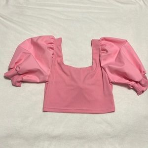 Pink ribbed puff sleeve crop top with bow in the back